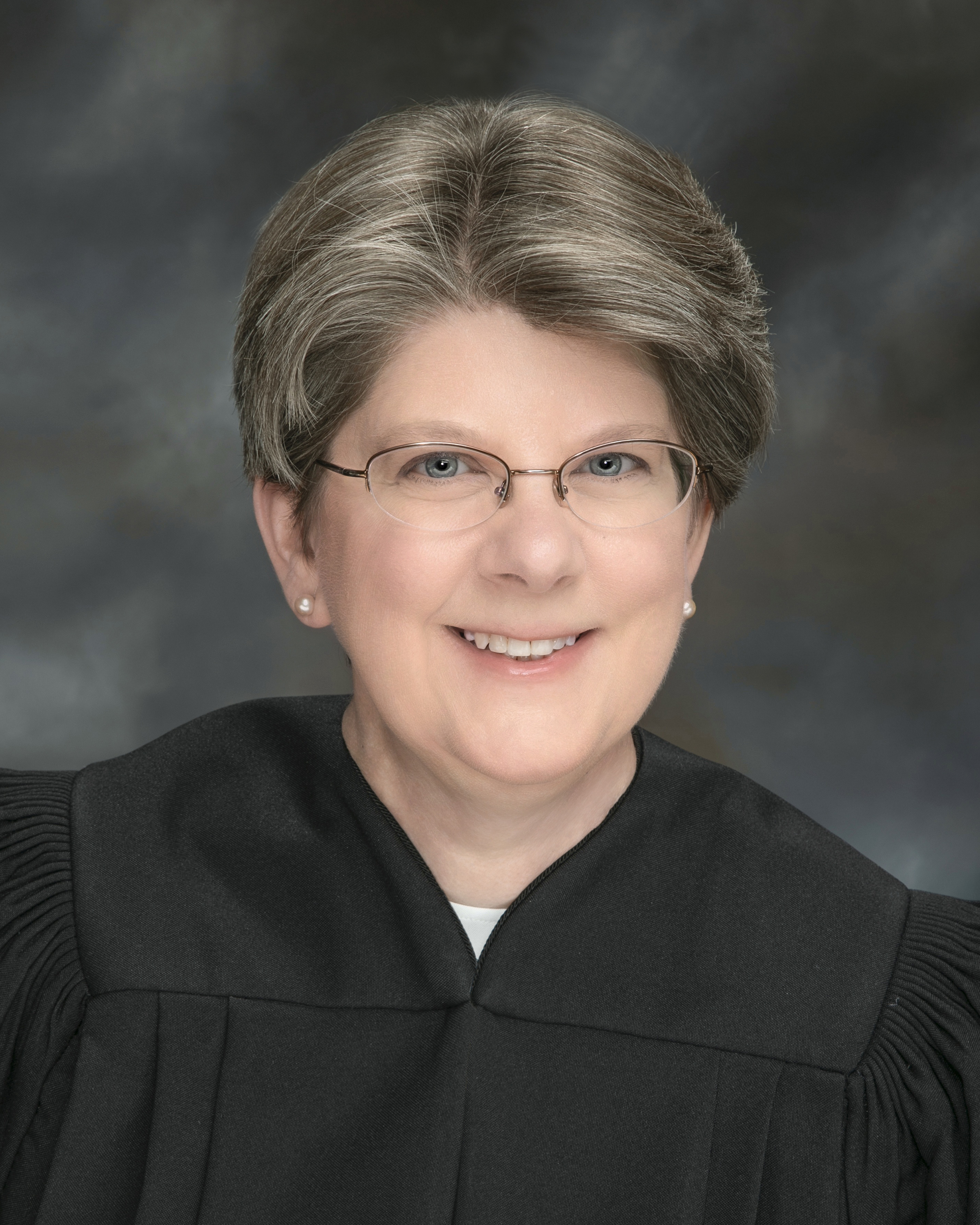 Portrait of Speaker Name
